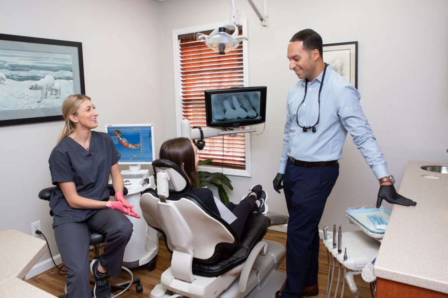 Dr. Sami and assistant talking with patient